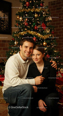 Couple Smiling Together by Decorated Christmas Tree