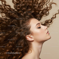 Profile of serene woman with voluminous curly hair