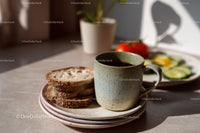 Coffee Mug with Toasted Bread and Fresh Vegetables in Natural Light