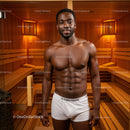 Muscular Man Standing in Sauna with Wooden Interior and Relaxing Atmosphere