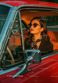 Stylish Woman in Sunglasses Driving Vintage Red Car in Sunset