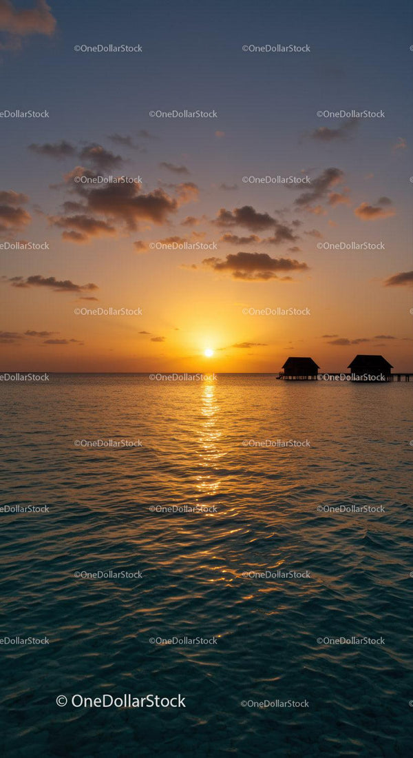 Beautiful Sunset Over the Ocean with Overwater Bungalows