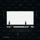 Silhouettes of Speakers Crossing Stage in Dark Auditorium