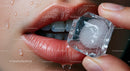 Close-Up of Glossy Lips with Ice Cube for Refreshing Hydration