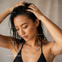 Beautiful Woman with Wet Hair Relaxing in a Minimalist Indoor Setting