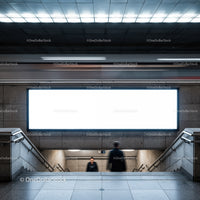 Blurred commuters in modern subway station stairway