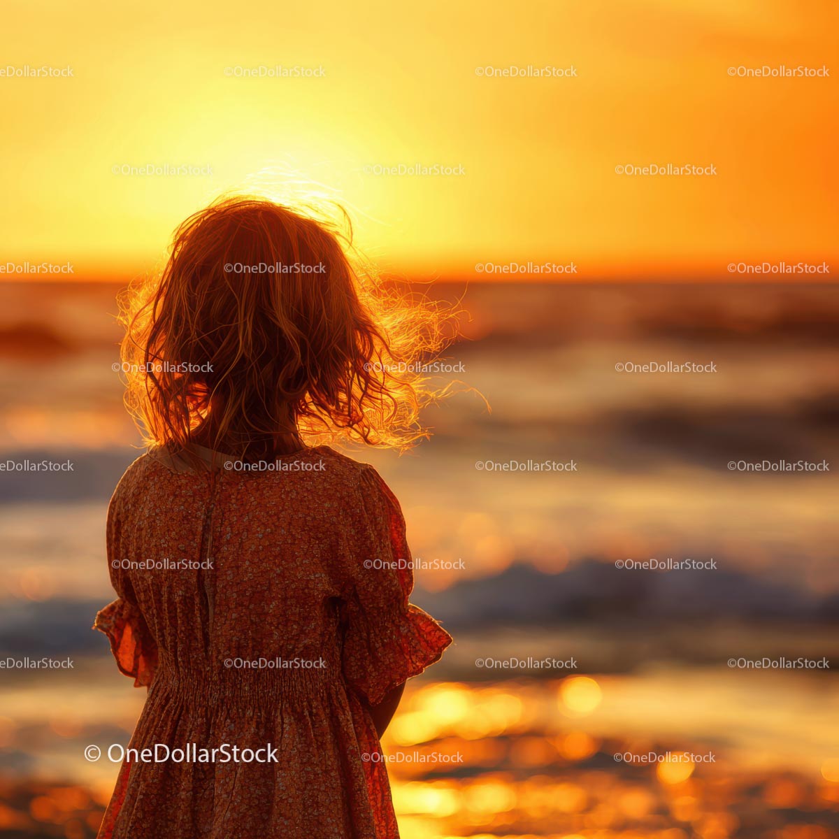 Silhouette of a Child at Sunset by the Ocean Shore
