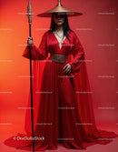 Elegant Woman in Red Dress with Accessories Against Red Background