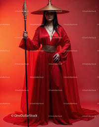 Elegant Woman in Red Dress with Accessories Against Red Background