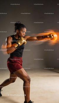 Focused female boxer delivering powerful punch