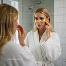 Young Woman Applying Under Eye Collagen Patches During Skincare Routine