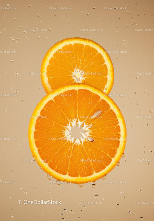 Fresh Orange Slices Submerged in Water Droplets