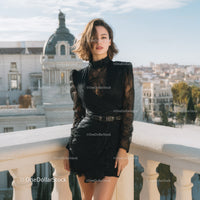 Stylish Woman in Black Lace Dress on Rooftop Overlooking City