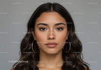 Close Up of a Stylish Woman with Brown Eyes and Hoop Earrings