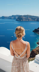 Woman enjoying scenic sea view on sunny terrace