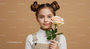 Young Girl with Pale Peach Rose Portrait on Soft Beige Background