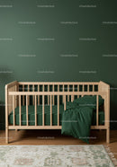Modern Wooden Baby Crib with Green Bedding in Nursery Interior