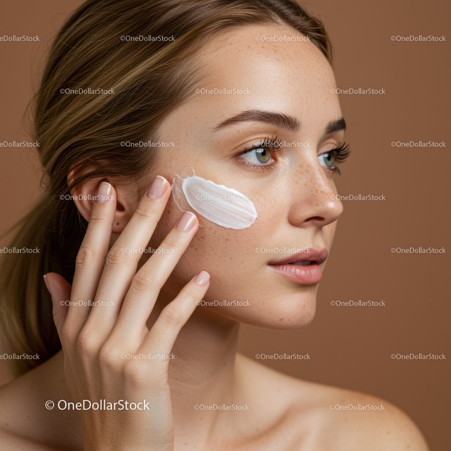 Young Woman Applying Face Cream for Skincare Routine