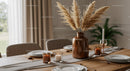 Elegant Interior with Dried Pampas Grass and Candlelit Table Setting