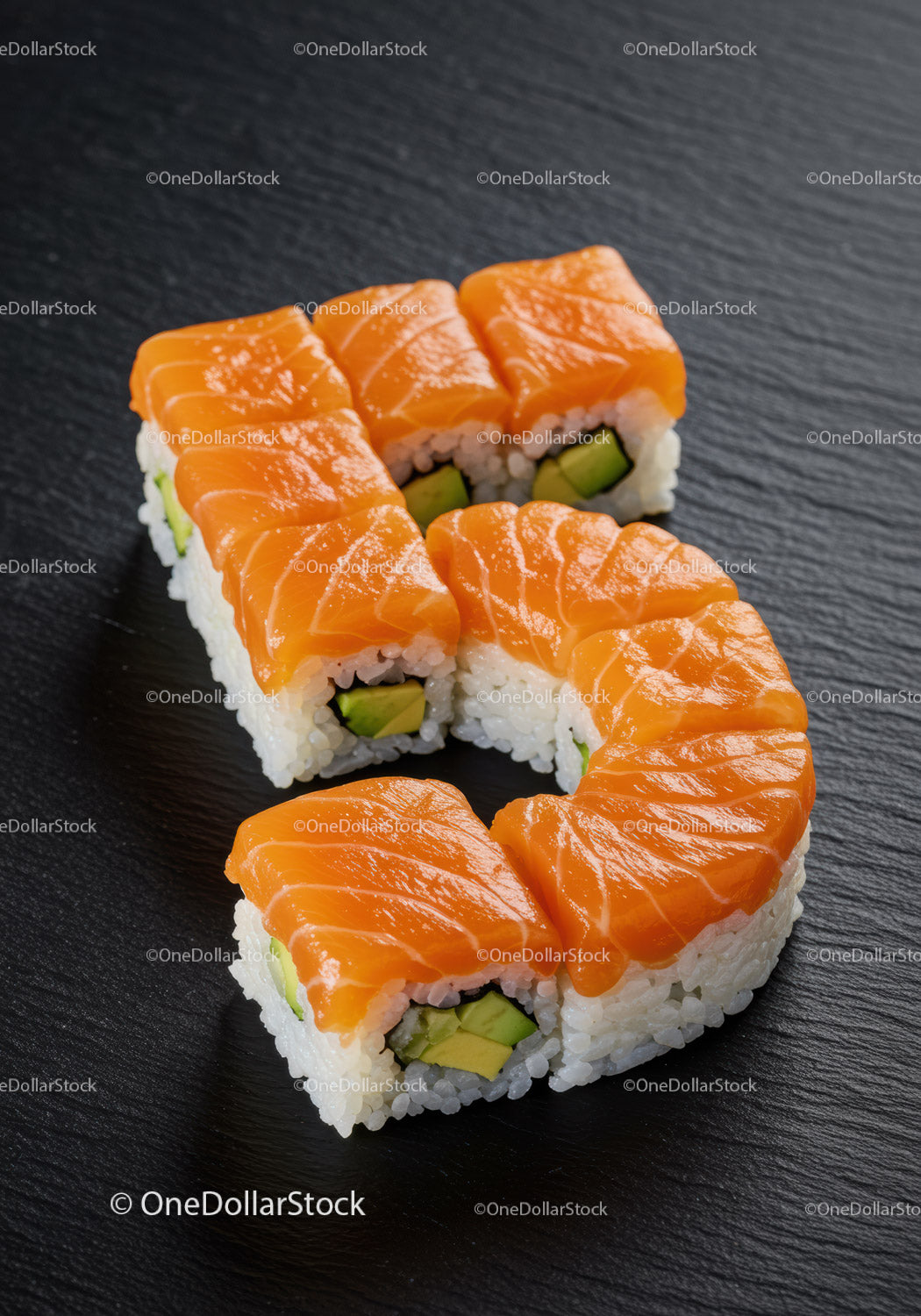 Salmon sushi rolls arranged in number five shape