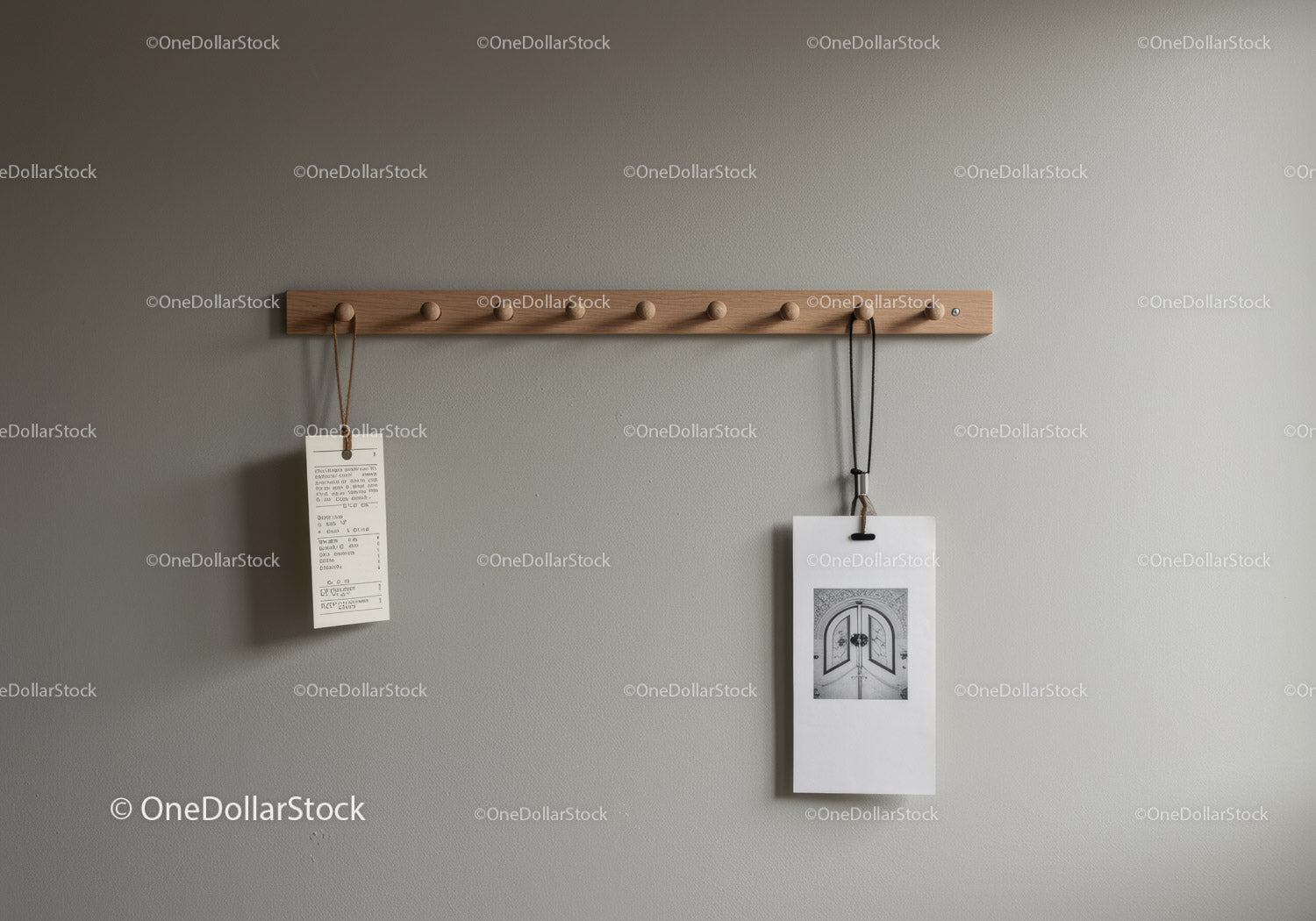 Wooden Coat Rack with Hanging Items on Gray Wall Interior