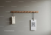 Wooden Coat Rack with Hanging Items on Gray Wall Interior