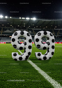Number ninety nine shaped like soccer balls on field