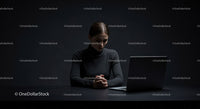 Thoughtful Woman at Laptop in Dark Modern Workspace