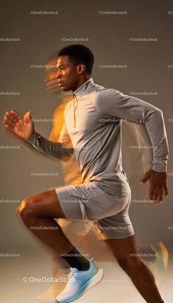 Focused male athlete sprinting in dynamic motion