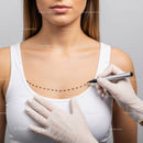 Close Up of Woman Undergoing Breast Examination or Surgery