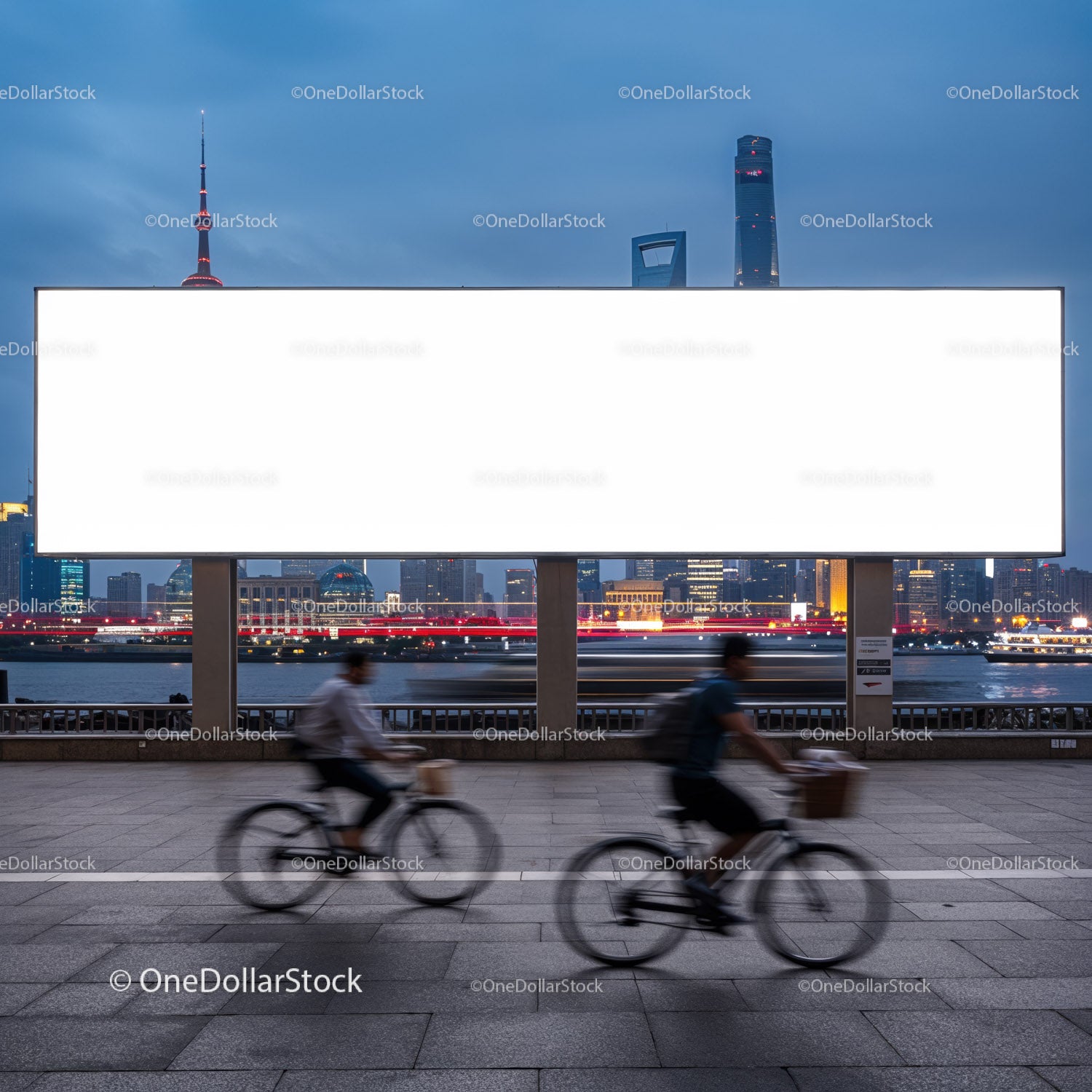 Cyclists Passing by Large Blank Billboard at Dusk