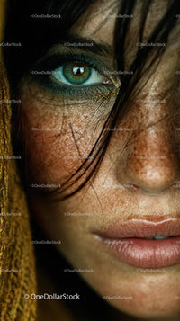 Detailed Close-up of Woman's Vibrant Green Eye and Facial Features