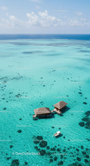 Overwater Bungalow in Turquoise Ocean with Clear Waters and Boat