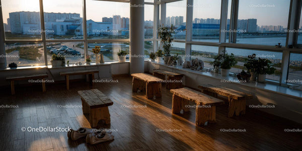 Bright Modern Lounge with Large Windows and City Skyline View