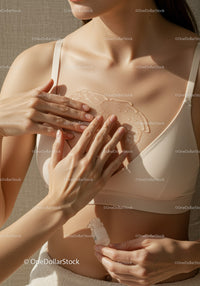 Woman Applying Body Oil for Radiant Skin in Wellness Routine