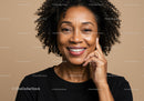Portrait of a Smiling Black Woman with Curly Hair in Professional Setting