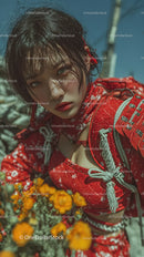 Fashionable Young Woman in Red Kimono in Blooming Garden