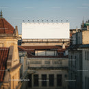 Empty billboard over city rooftops at golden hour