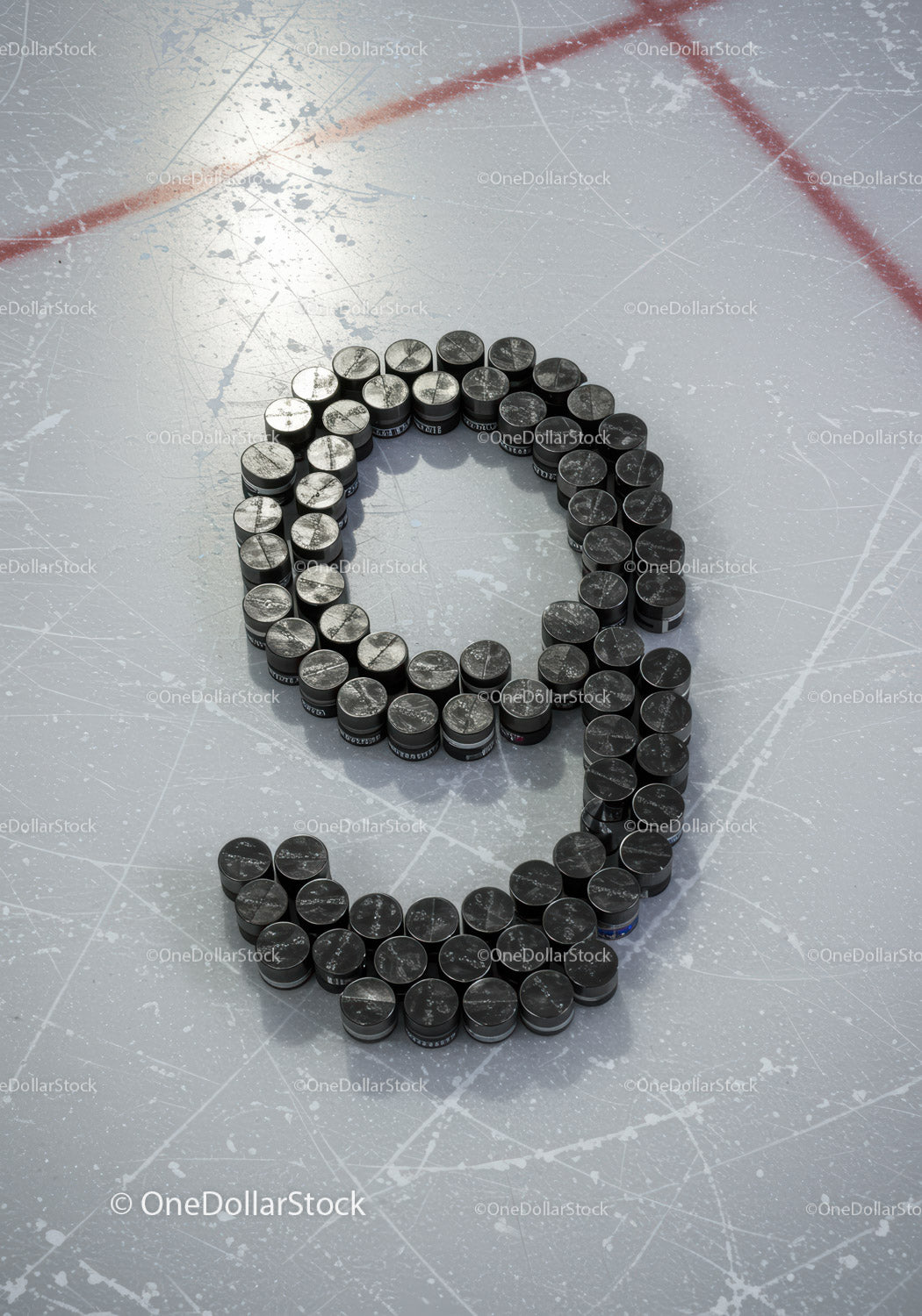 Number nine formed with hockey pucks on ice rink