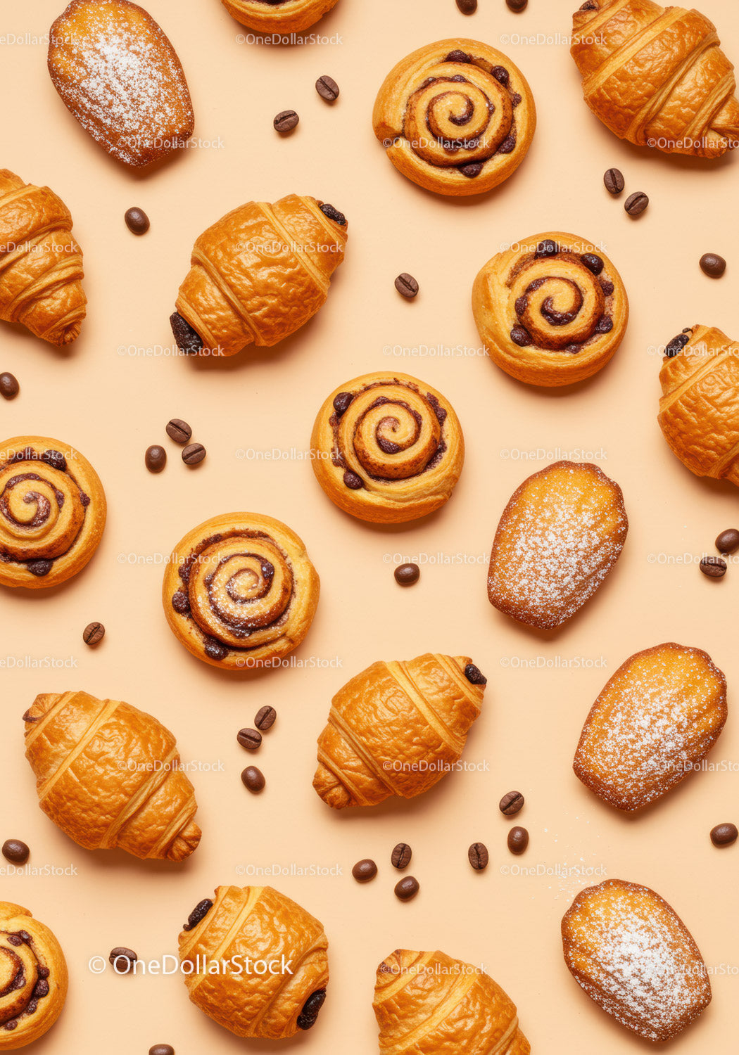 Fresh assorted pastries and coffee beans on beige background