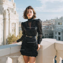 Stylish Woman in Black Lace Dress on City Rooftop