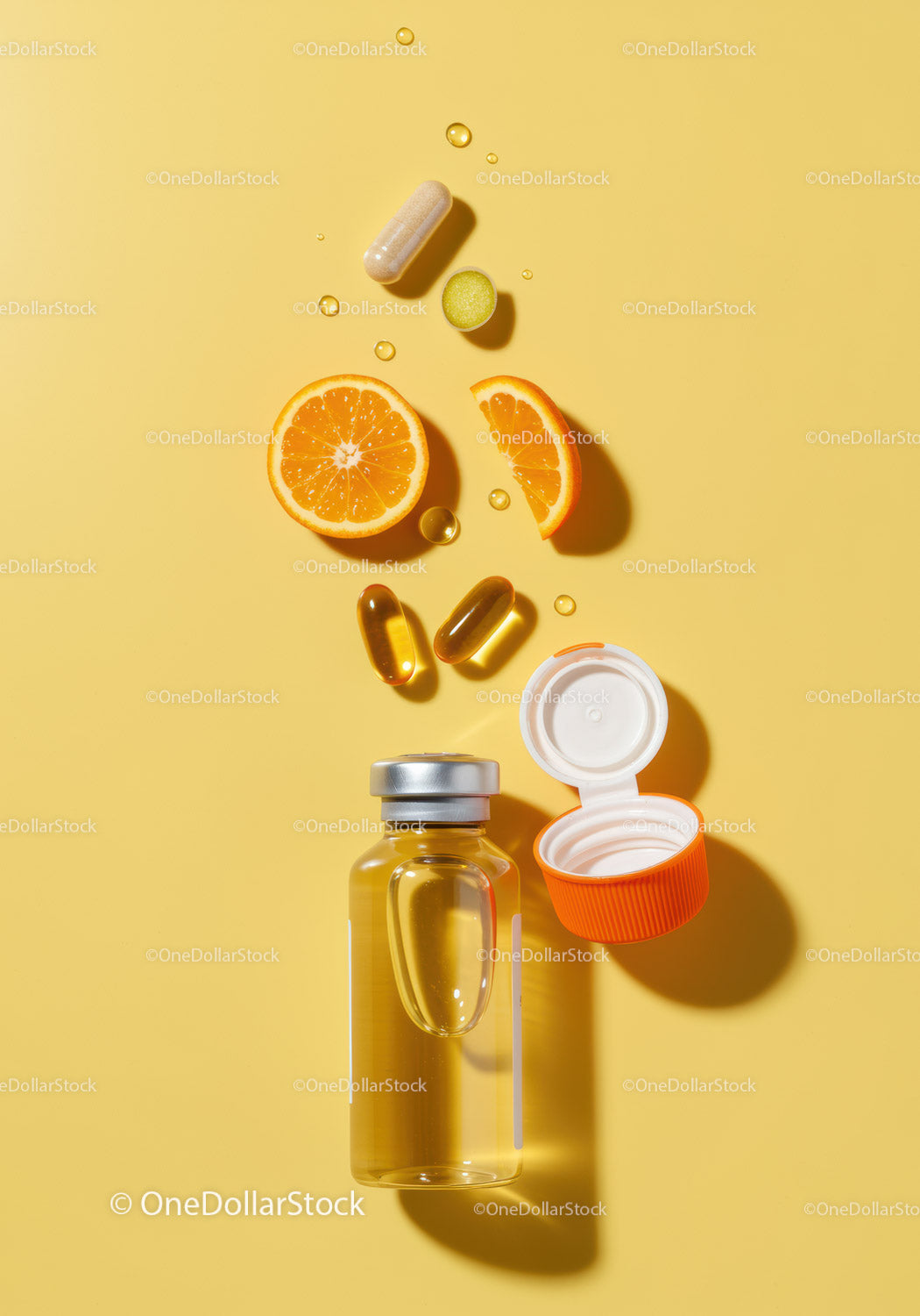 Vitamin C supplement capsules with fresh orange slices