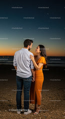 Couple sharing intimate moment at sunset on the beach