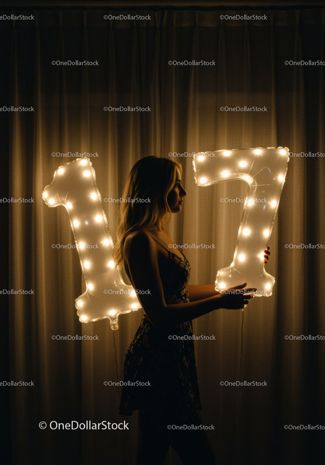 Young Woman Holding Lit Number Balloons in Dark Room