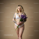 Portrait of a Tattooed Woman Holding Purple Flowers in Lingerie Studio