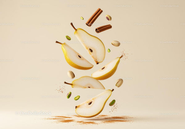 Fresh pear slices with cinnamon and pistachios floating