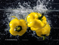 Vibrant Yellow Bell Peppers in Water Splash