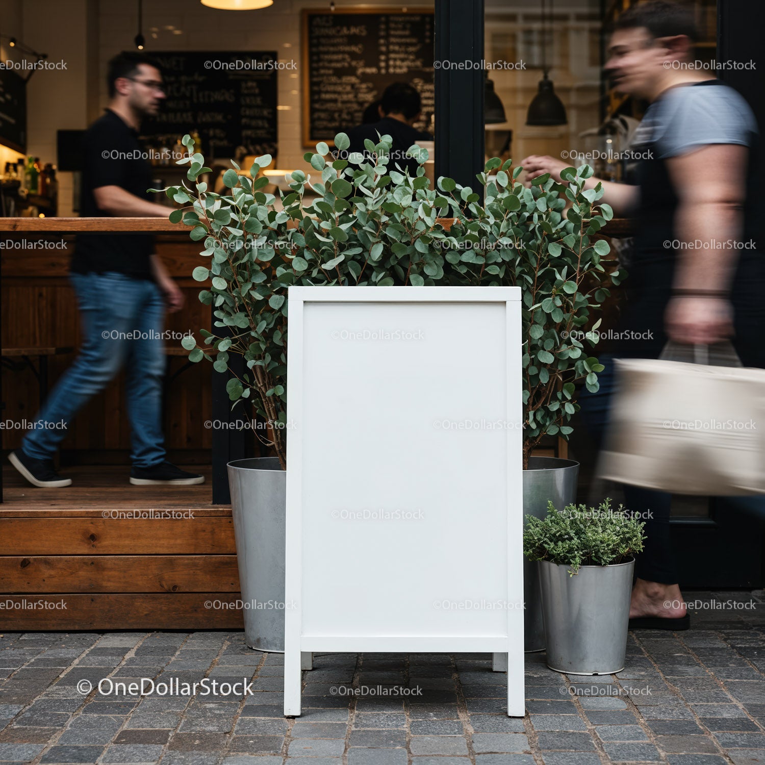 Blank outdoor menu board with potted plants in cafe entrance