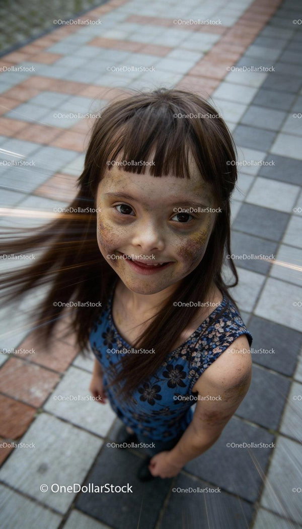 Joyful Girl with Down Syndrome Playing Outdoors