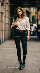 Stylish Woman Walking in City Streets Wearing Black Jeans and Beige Shirt